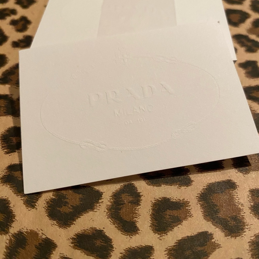 Prada white blotter card